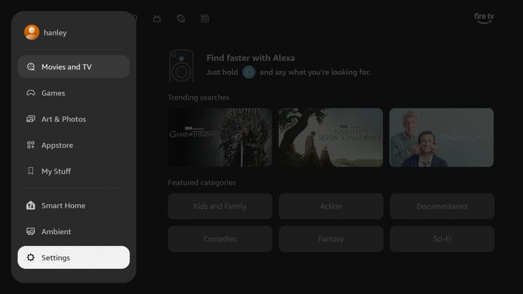 From your Fire TV home screen, hover over the hamburger icon and click Settings on the bottom left.