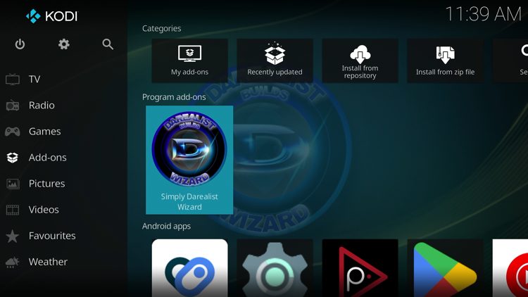 Return back to the home screen of Kodi, hover over Add-ons and click Simply Darelist Wizard under Program add-ons.